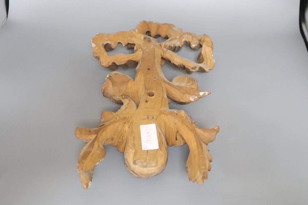 A carved beech ribbon and fruit wall applique, length 47cm